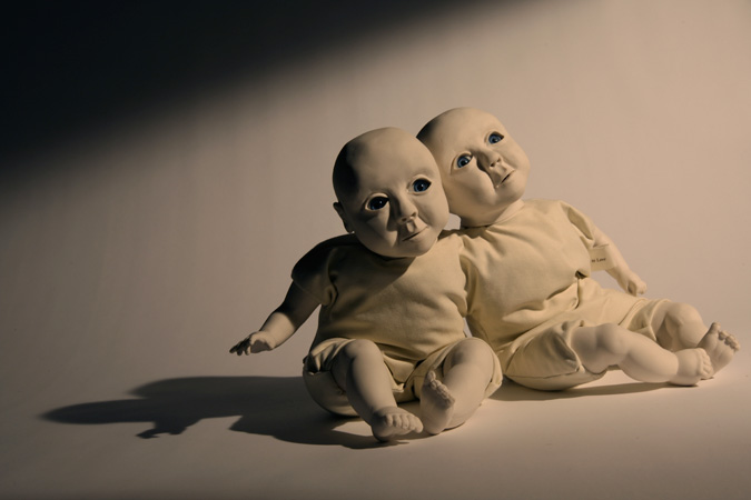 'Babies to love' Slip-cast porcelain from hand modelled wax and doll parts, glass eyes and textiles. Photography by Jonny Briggs.
