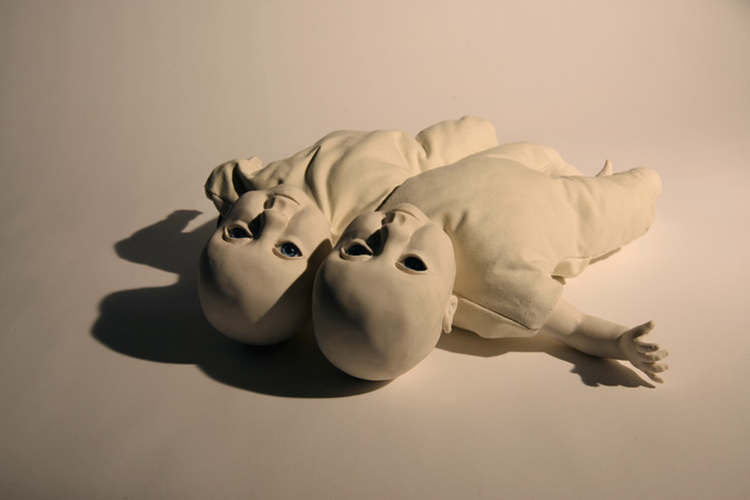 'Babies to love' Slip-cast porcelain from hand modelled wax and doll parts, glass eyes and textiles. Photography by Jonny Briggs. 'Babies to love' Slip-cast porcelain from hand modelled wax and doll parts, glass eyes and textiles. Photography by Jonny Briggs.